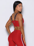 Back-right view of the sunset red United Tank, featuring buttery-soft, mega-stretch fabric
