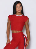 Soft heathered United Tee Sunset Red crop top, designed for a snug, high-performance gym fit.