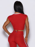 Sculpting United Tee Sunset Red top viewed from behind, showcasing a clean cut and sporty seams.