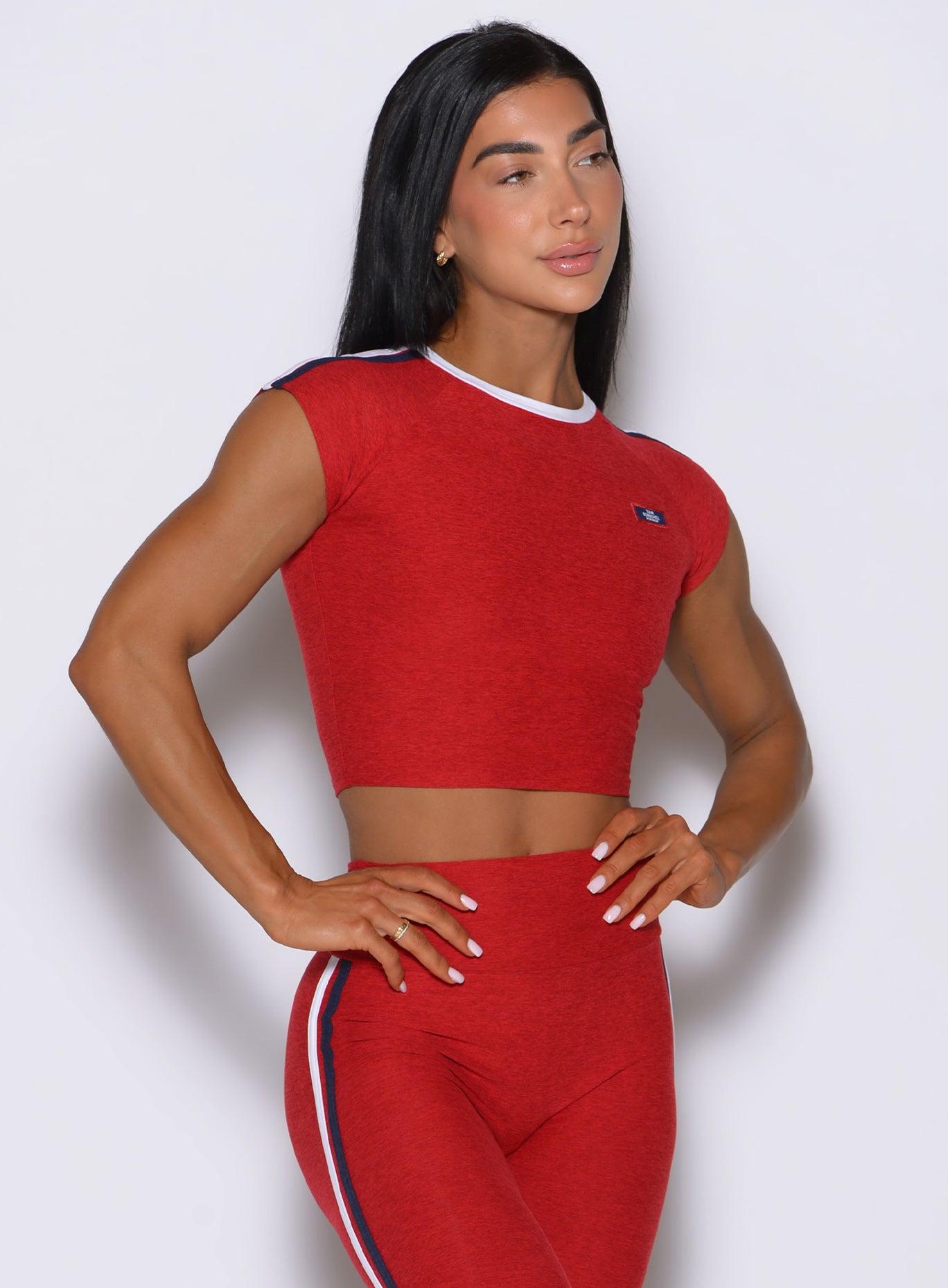 Mid-shot front view of the United Tee Sunset Red, built from soft heathered fabric for training.