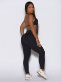 Right profile of sweat-wicking Obsidian Black Bombshell Sportswear Uplift Peach Leggings