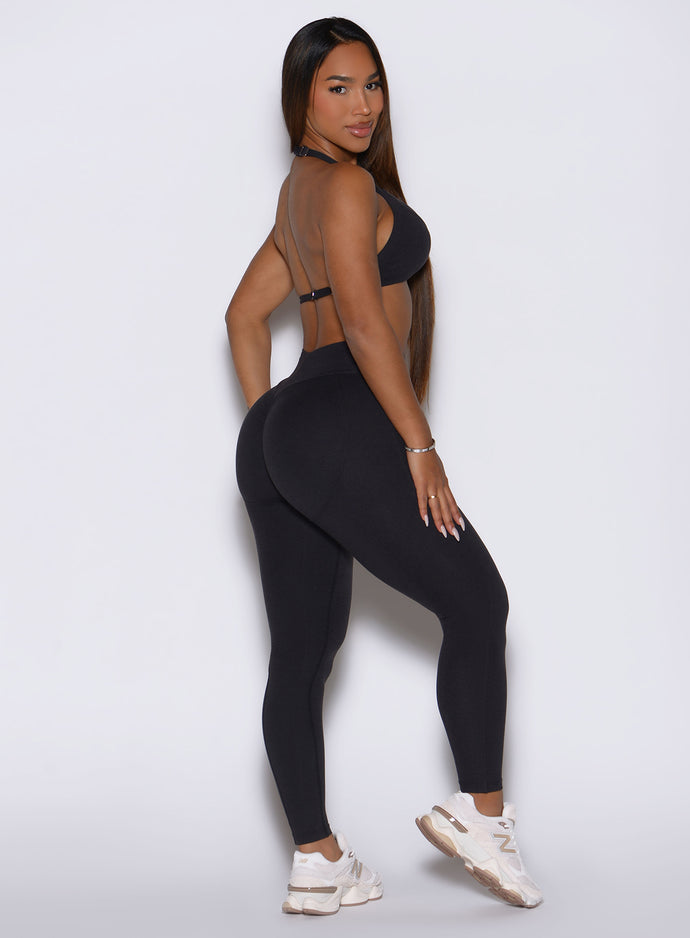 Right profile of sweat-wicking Obsidian Black Bombshell Sportswear Uplift Peach Leggings