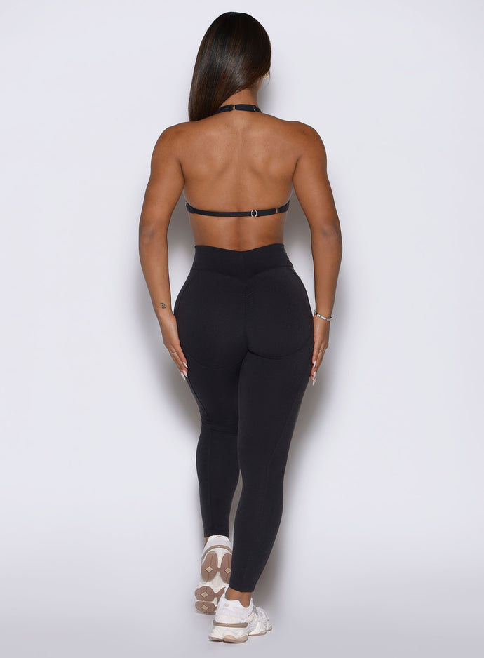 Glute-enhancing scrunch butt seam on Obsidian Black Bombshell Sportswear Uplift Peach Leggings