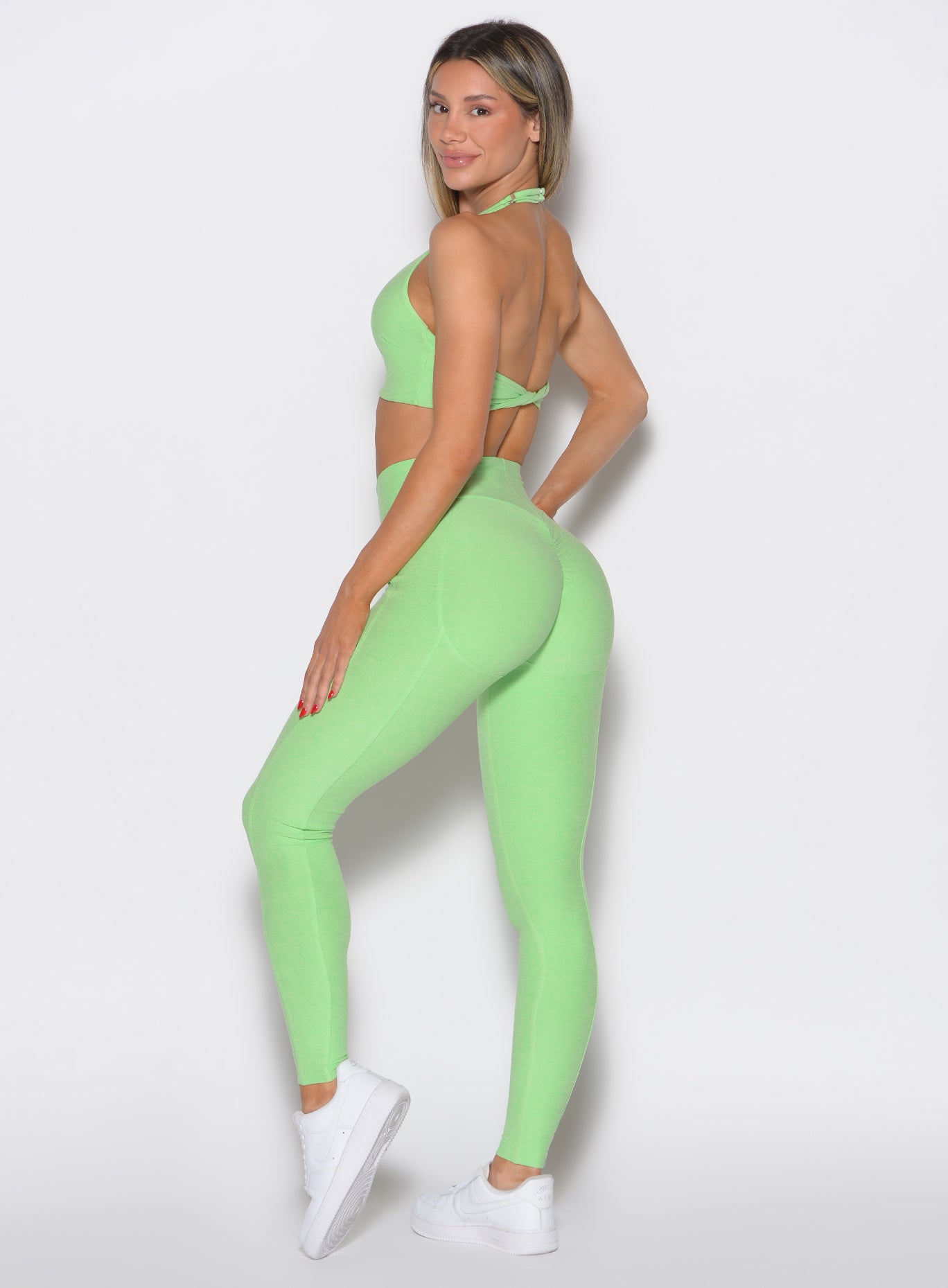 Electric Green Uplift Peach Leggings with a high-waisted, sculpting fit and contouring seams.