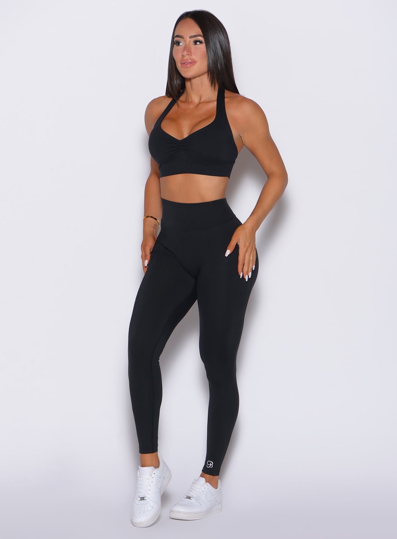 Sculpting black V Back Leggings featuring a snatching V-waistband and curve-enhancing scrunch seam.