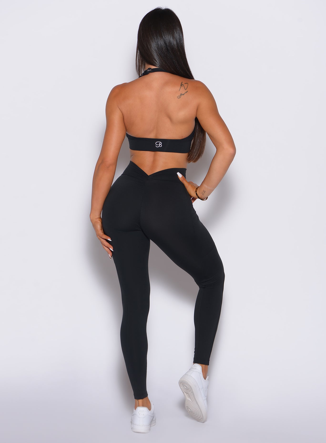 Sculpting Black V Back Leggings with a signature V-scrunch and side pockets for gym gains.