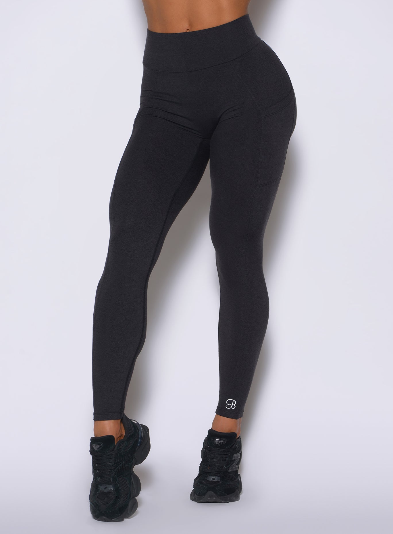 Close-up of Obsidian Black V Back Leggings highlighting the seamless front and supportive waistband fit