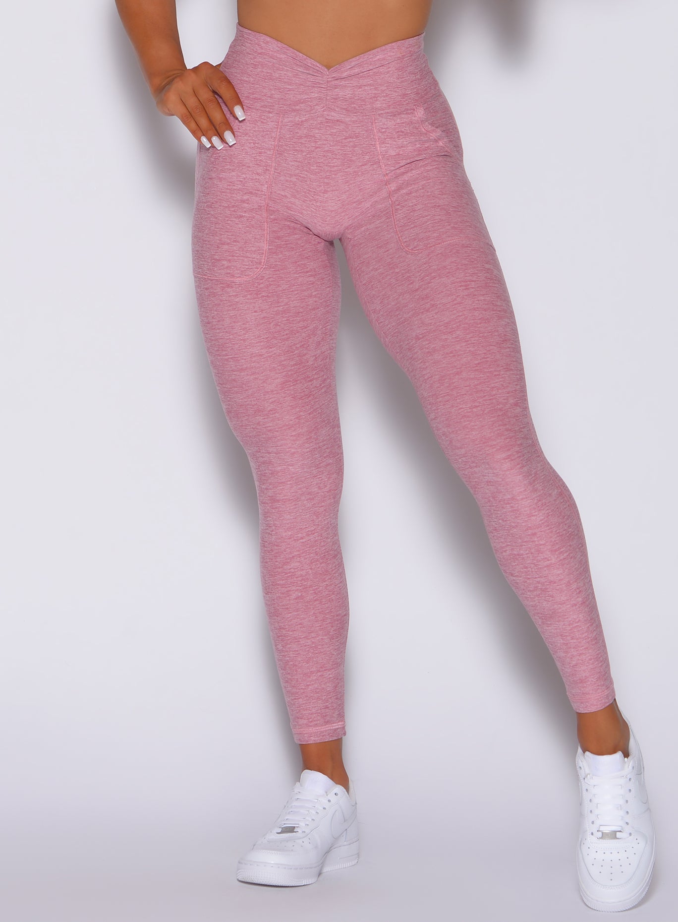 zoomed in front view of our V scrunch leggings in rose blush color 