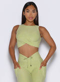 frontal view of a model wearing the Two Cute Tank Bra in serpentine color paired with the matching leggings 