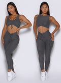 front profile view of a model showcasing the two way wearing option of the Two Cute Tank Bra in steel shadow color