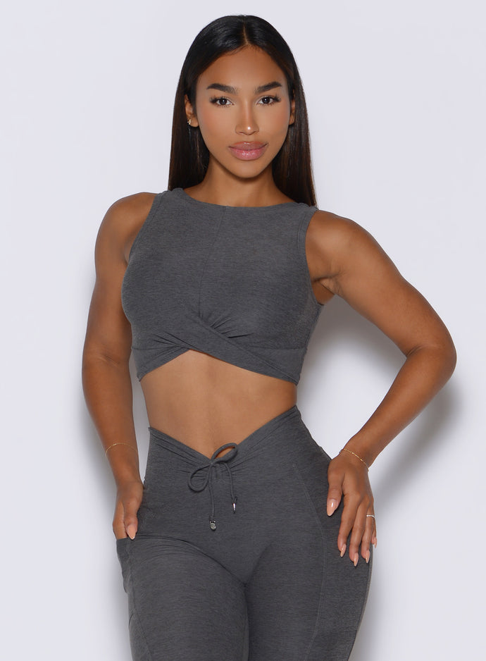 front view of a model wearing the Two Cute Tank Bra in steel shadow color paired with the matching leggings 