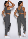back profile view of a model showcasing the two way wearing option of the Two Cute Tank Bra in steel shadow color