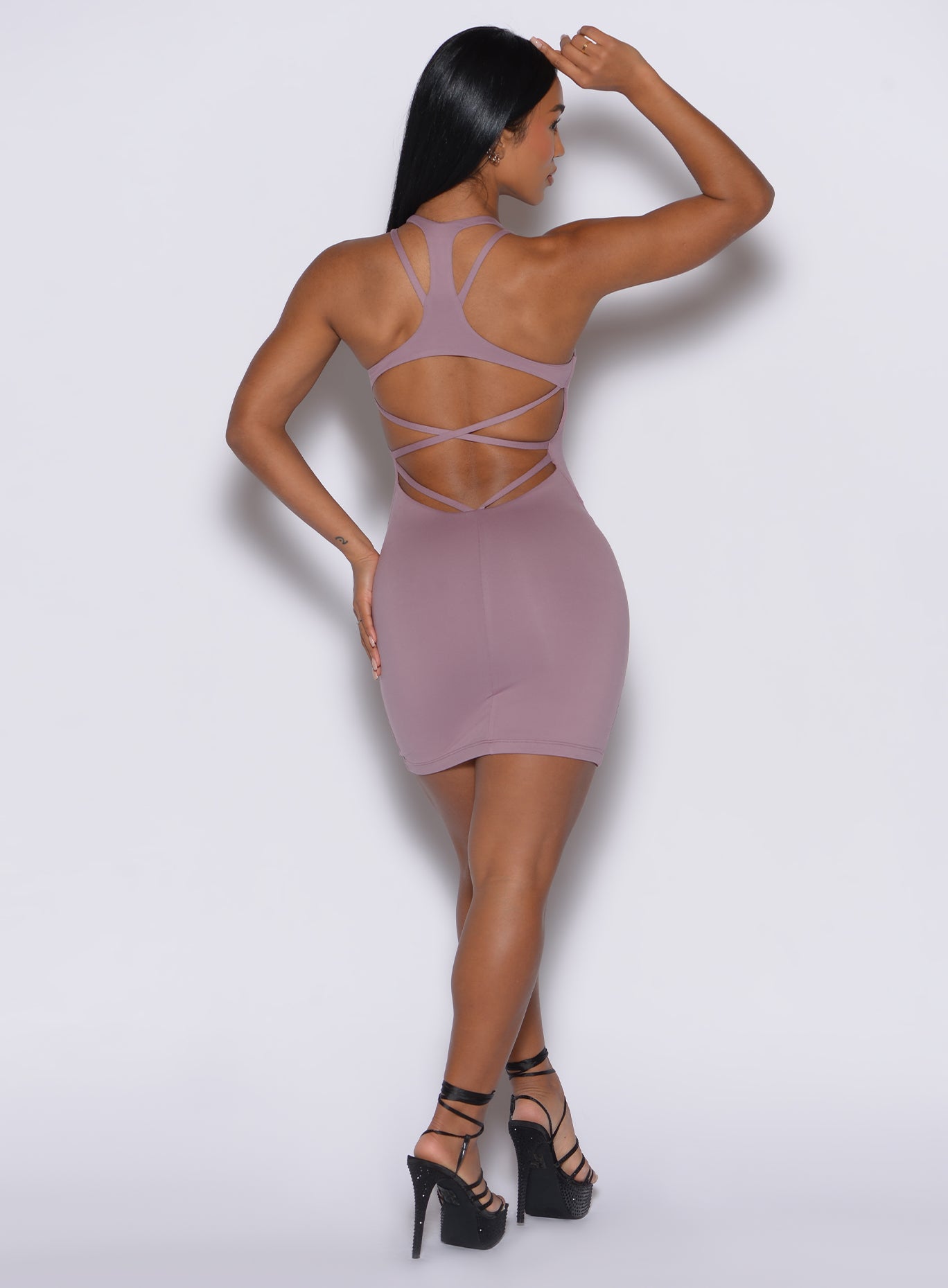 back profile picture of a model wearing our viral dress in light mauve color