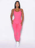 Front profile view of our model wearing the Athletic Bodysuit in Neon Flame color