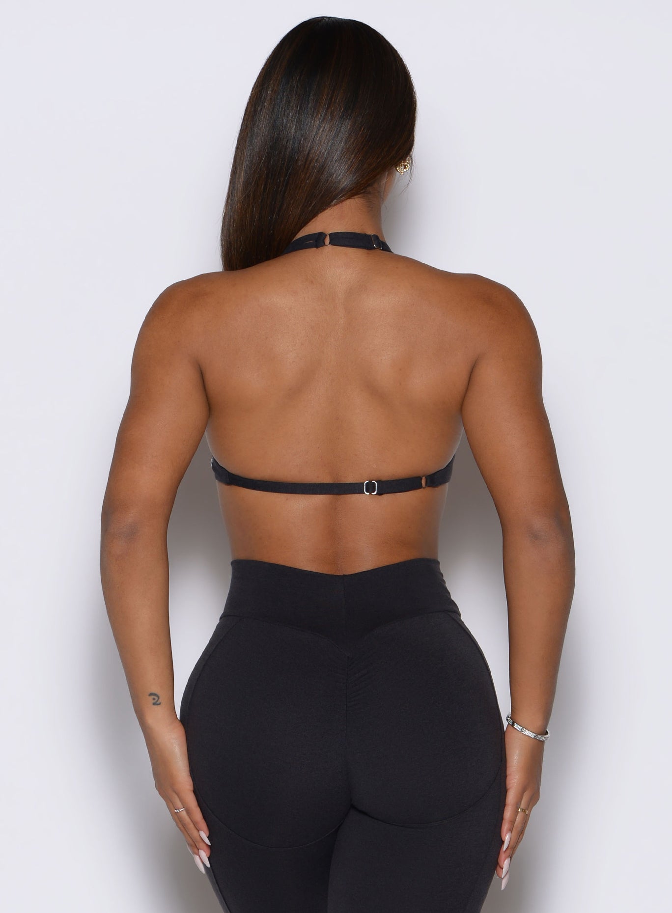 Open, strappy back design on the heathered Obsidian Black Bombshell Sportswear Voltage Bra