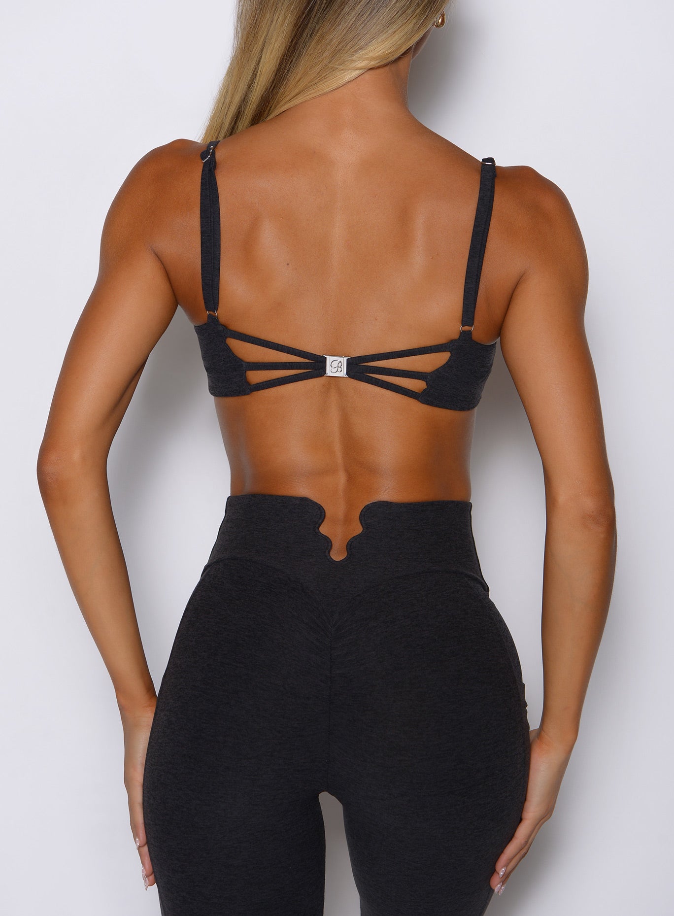 Heathered Black Wave Wire Bra featuring an open-back strappy design for high-performance support.