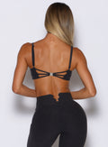 back profile view of a model wearing the Wave wire bra in heathered black color