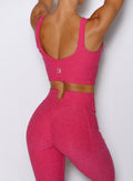 close up back side view of a model wearing the Wave Wire Leggings in pink paradise color
