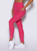 close up left side view of a model wearing the Wave Wire Leggings in pink paradise color