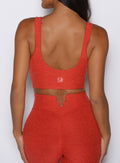 close up back profile view of a model wearing the Wave wire tank in firestorm color