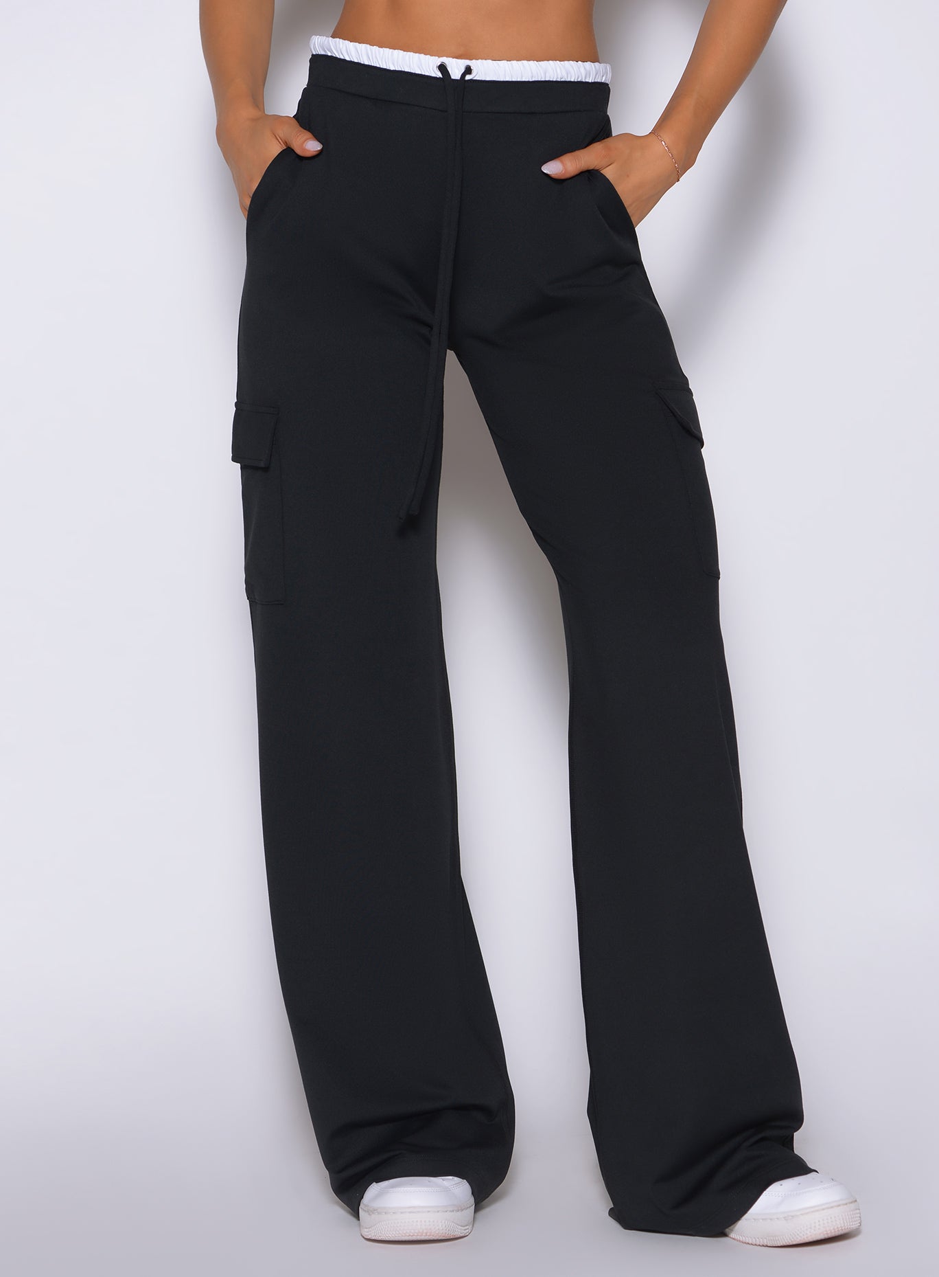 Bombshell Sportswear black wide-leg cargo lounge pants side detail featuring high-waist fit, soft drape fabric, side cargo pockets, relaxed silhouette, and elevated women’s athleisure styling