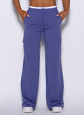 Close-up view of model wearing Bombshell Sportswear wide leg joggers in Future Dusk color, highlighting soft lightweight fabric and relaxed fit