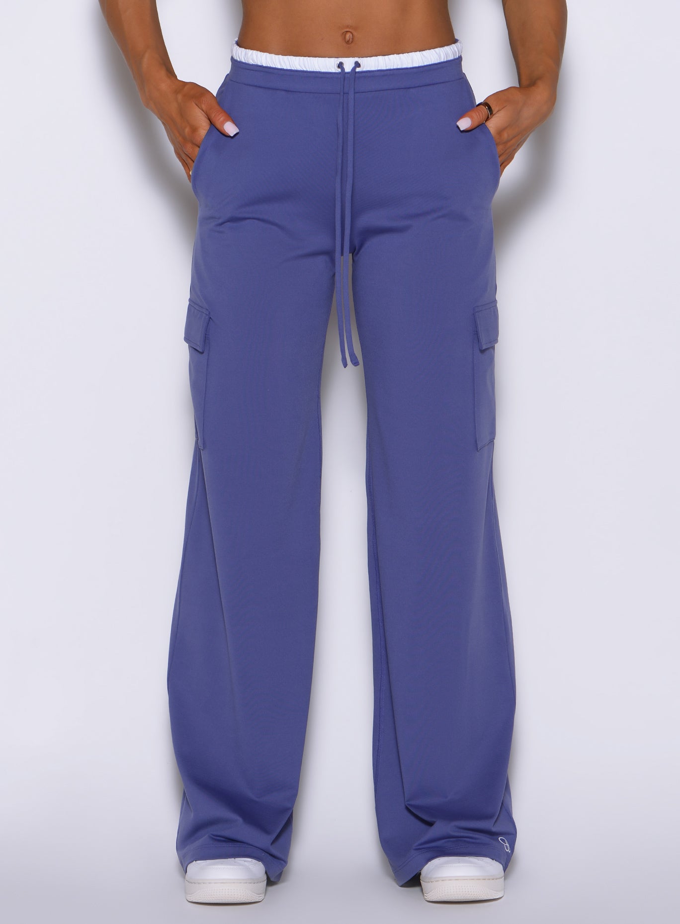 Close-up view of model wearing Bombshell Sportswear wide leg joggers in Future Dusk color, highlighting soft lightweight fabric and relaxed fit