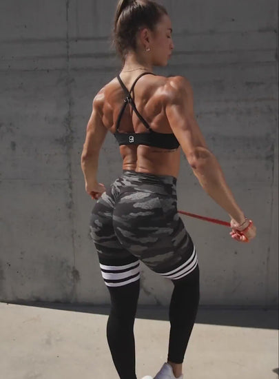 short video of a model in outdoors wearing a thigh highs leggings 