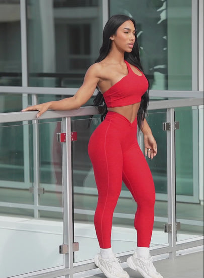 A short video of a model wearing our lateral top in scarlet red along with the matching leggings 