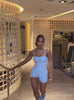 short video of a model in indoors wearing the true form bodysuit shorts in Niagara mist color