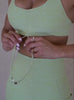 A short video showcase of a model wearing the Dual Charm Bra in serpentine color