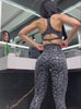 A short video of a model working out in our shine leopard leggings set in black leopard color 