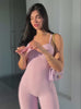 Video of a model in a pink sweetheart body suit and matching leg warmers.