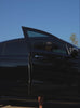A short video of a model coming out of a car wearing the PowerFit Dress in blue slate color