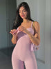 Video of a model in a pink sweetheart body suit and matching leg warmers.