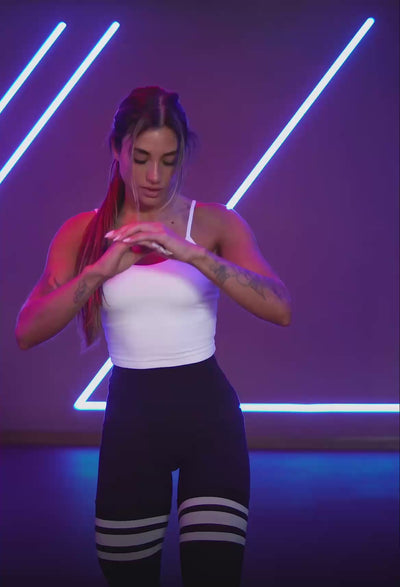 Video featuring an athletic model performing different types of high intensive workouts, wearing a pair of scrunch thigh-highs and a cinch cami tank
