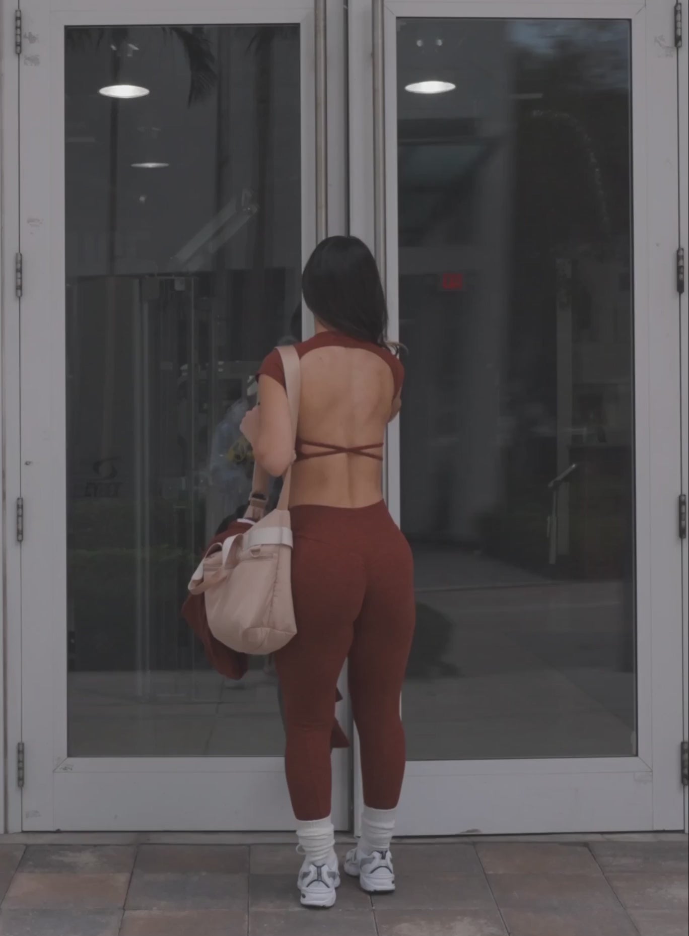 fit girl in gym working out wearing the cloud active set