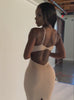 a short video of a model posing in our hourglass dress in camel color  