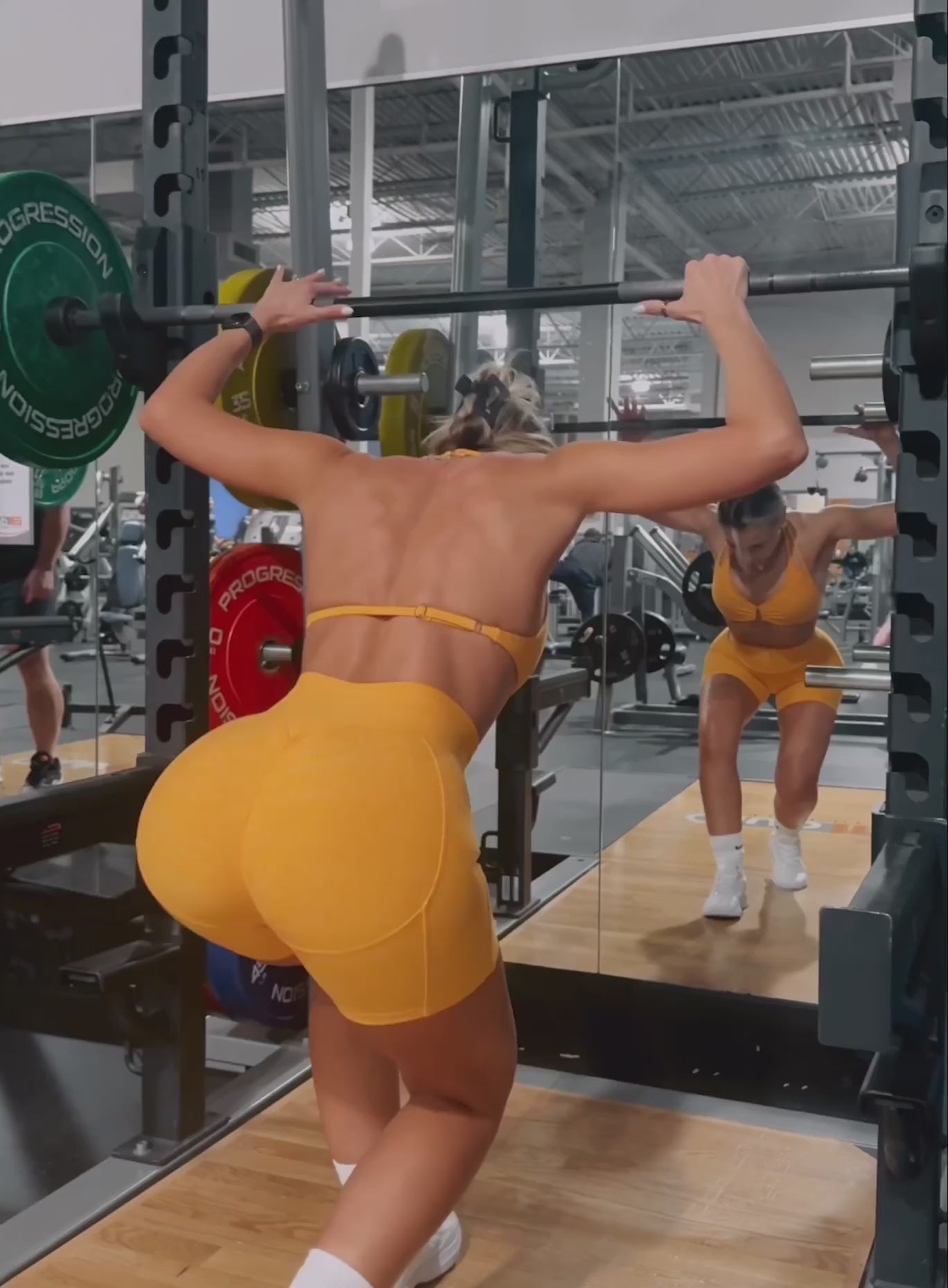 Uplift Peach Shorts in Kumquat featuring a high-waisted, butt-lifting fit for sculpting workouts.