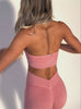 A short video showcase of a model wearing the Shimmer V Back Leggings in Pink star color paired with the matching top