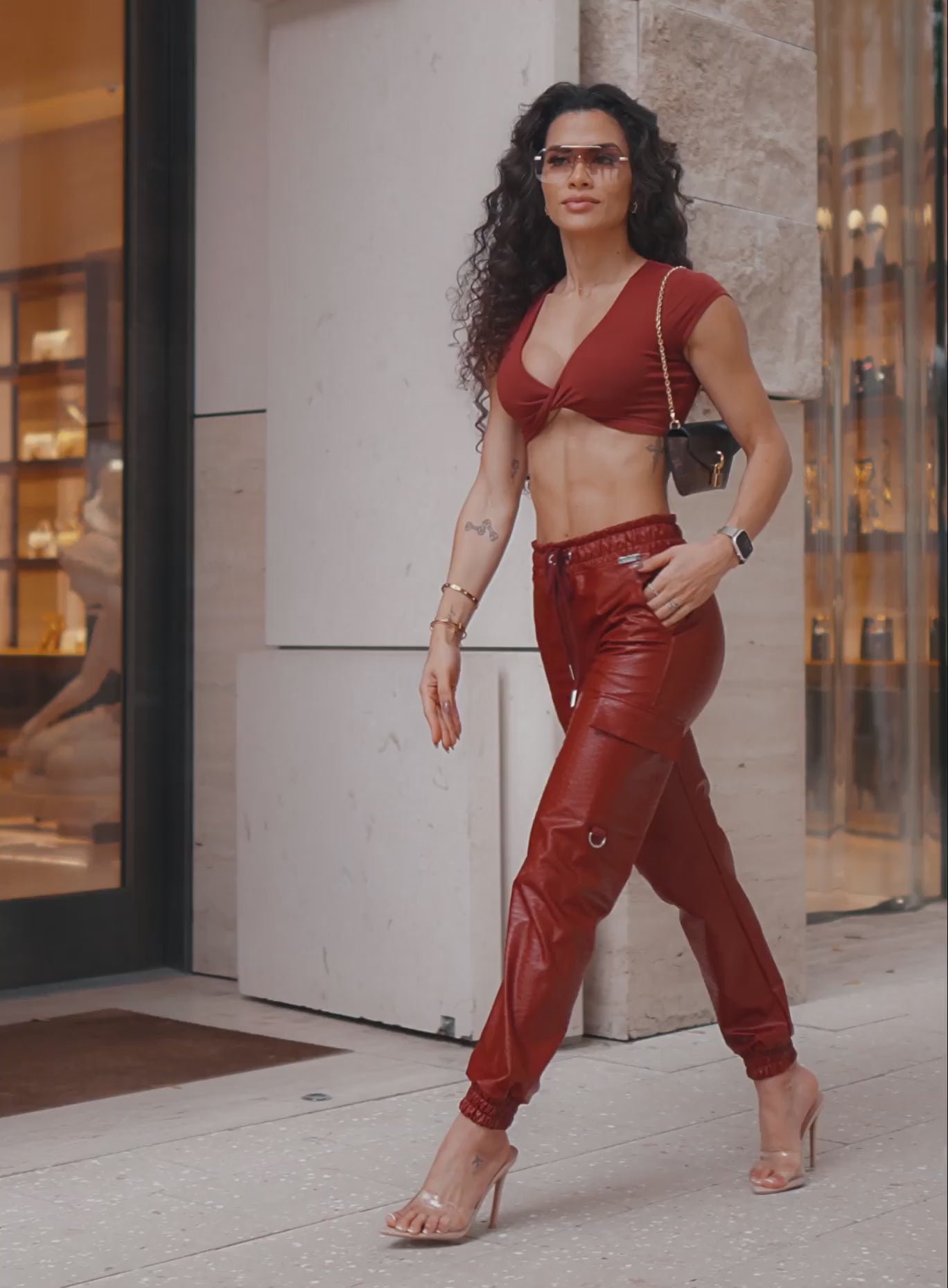 Sleek Brick Red Liquid Cargos; high-waisted pleather with cargo pockets and sculpting scrunch butt.