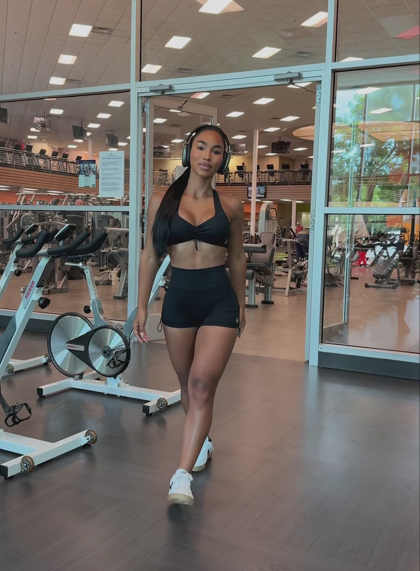 Black V-Back Toggle Shorts featuring adjustable toggle waist details and sculpting compression fit.