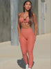 A short video showcase of a model in outdoors wearing the Define Leggings in spiced maple color paired with the matching bra 
