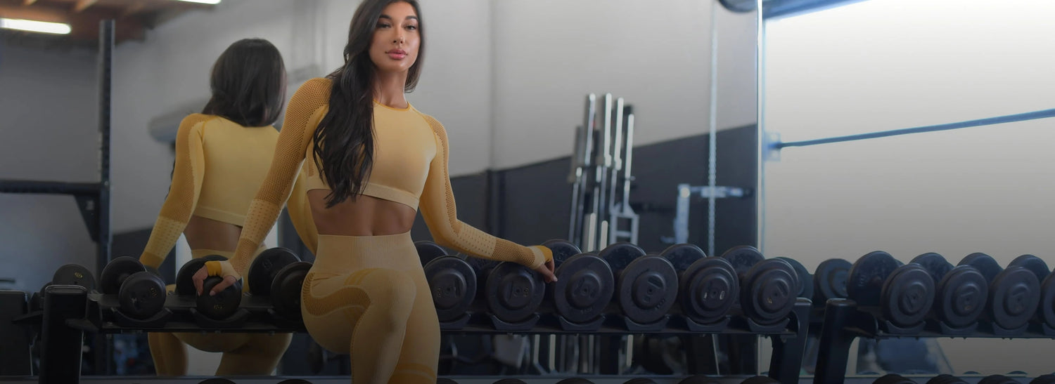 model wearing yellow long sleeve bra and matching yellow leggings