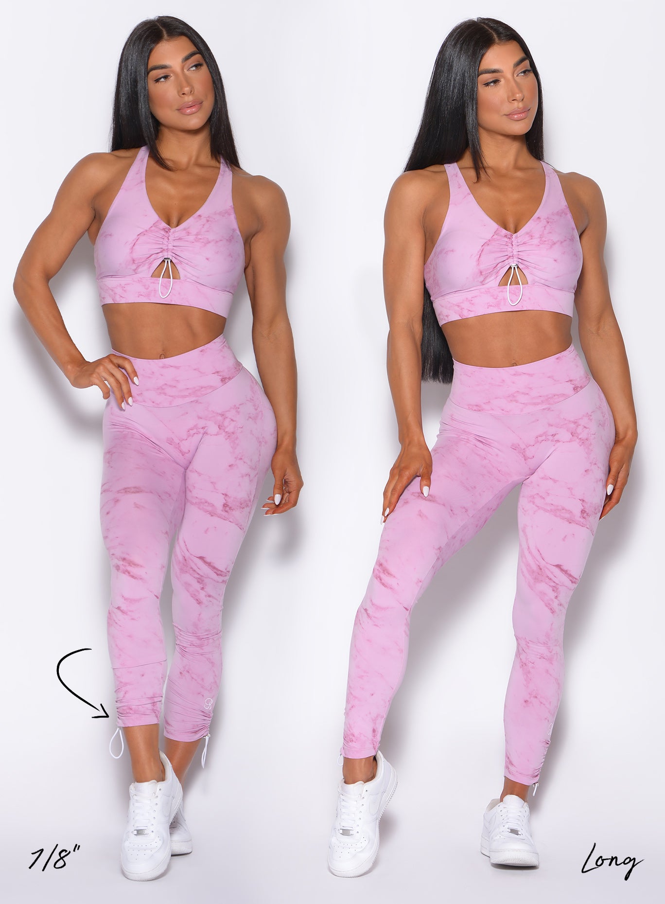 Picture of two models facing forward wearing our adjustable leggings in marble pink color showing how the length of the leggings can be adjusted 