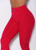 Zoomed in front view of our red barbell leggings 