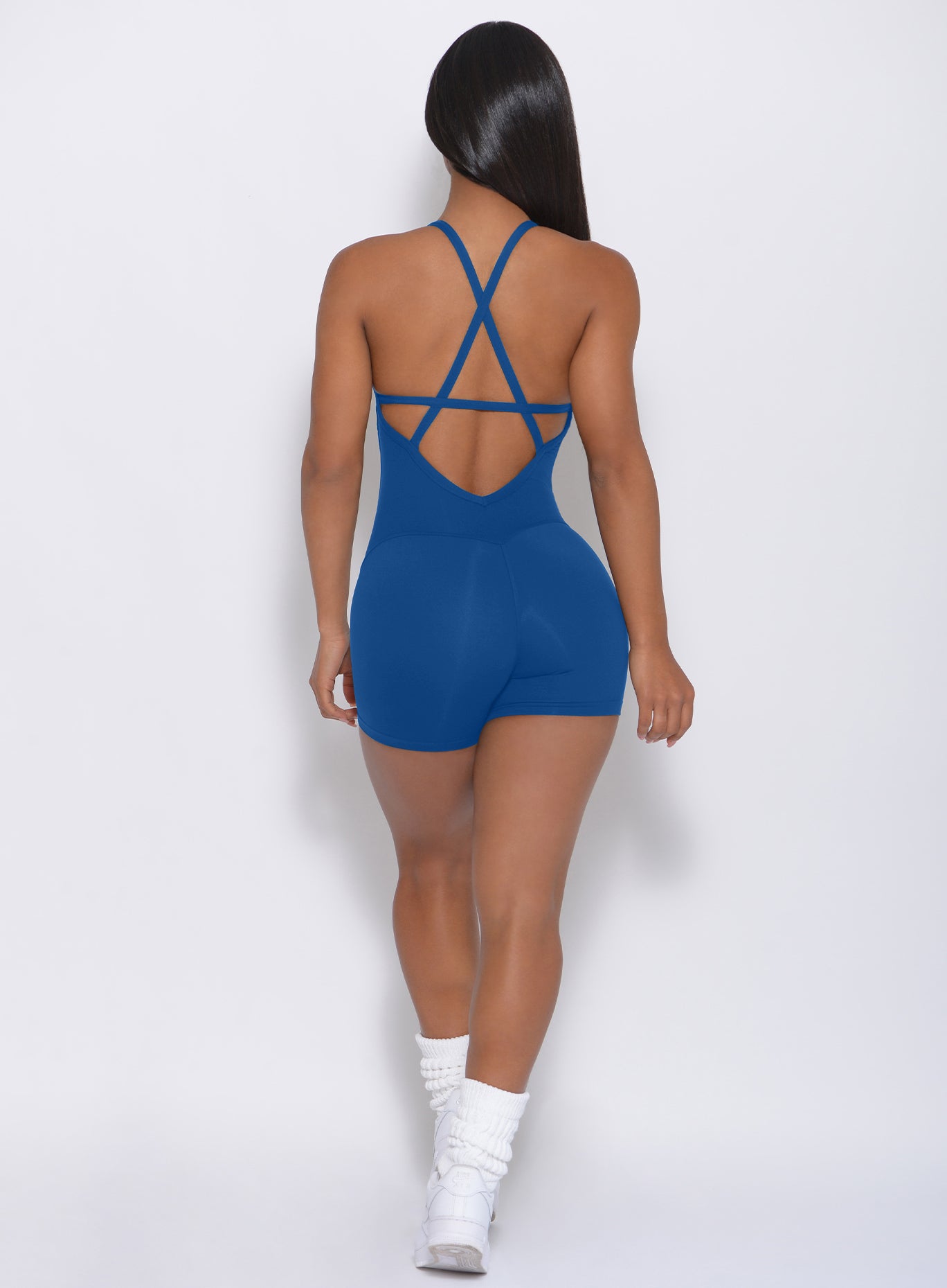 Back view of the model in our cobalt blue bodysuit shorts 