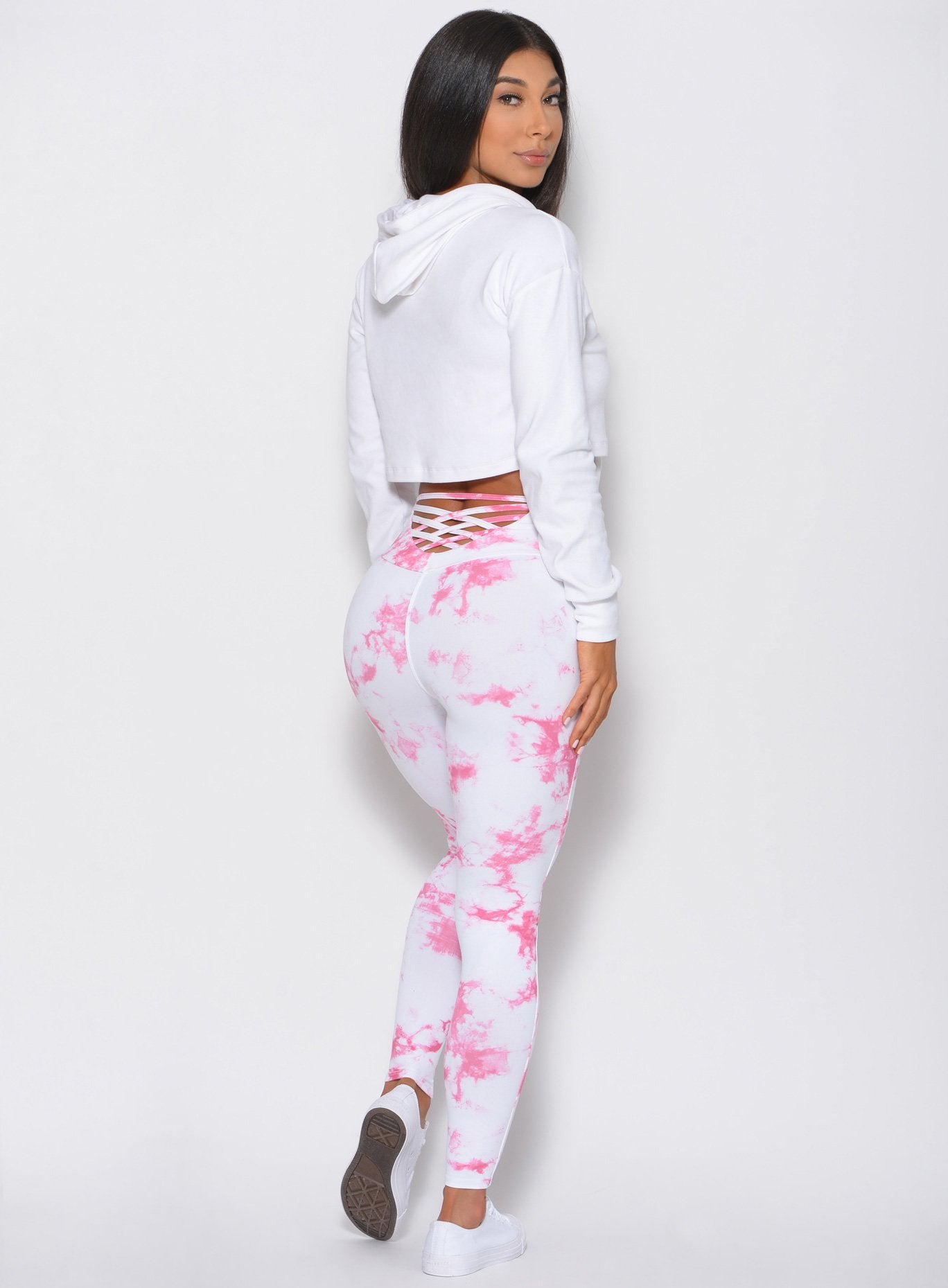 Full back view of the model wearing the Bombshell Crop Hoodie in white