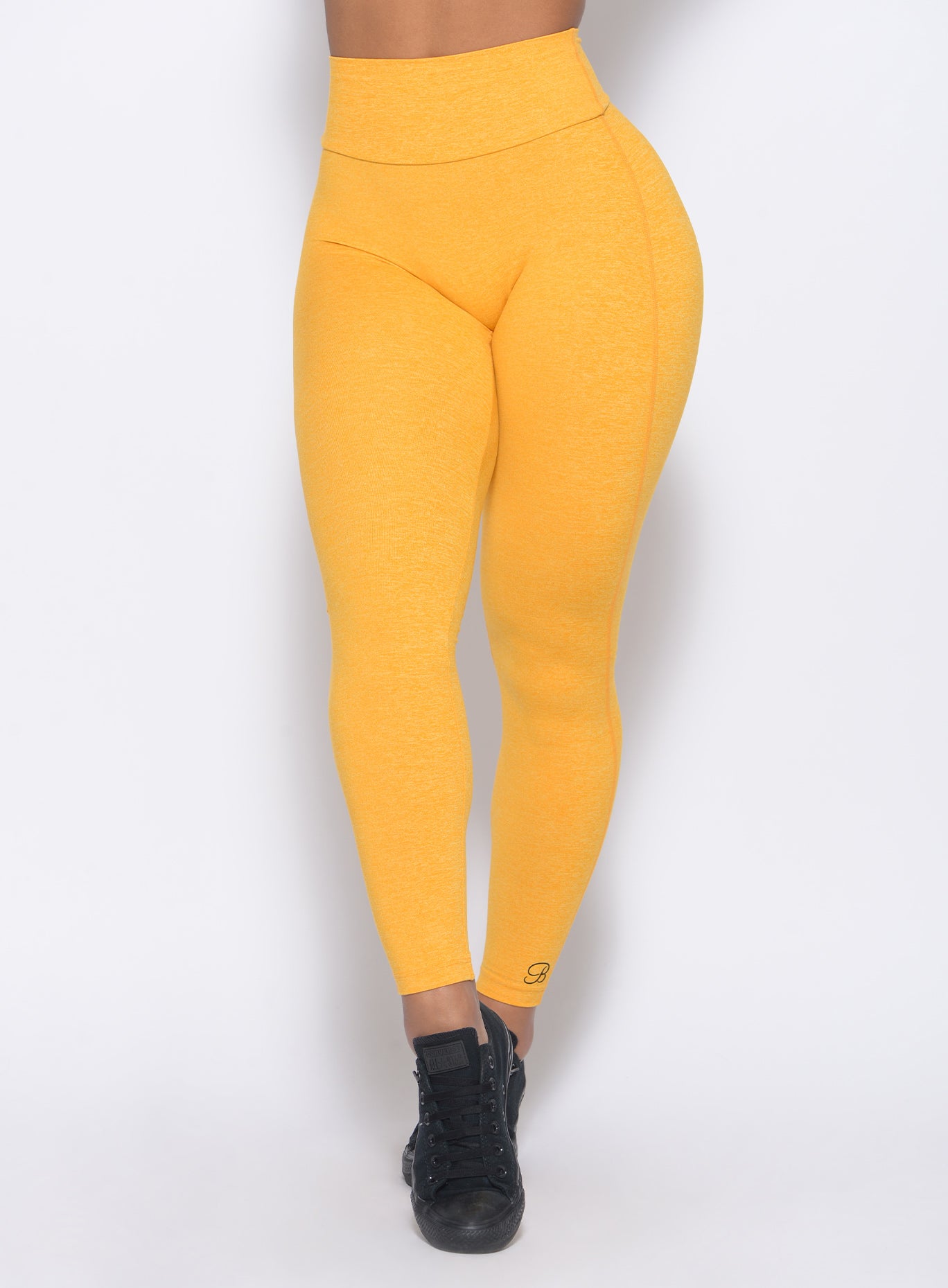 Zoomed in view of our boost leggings in sunkissed color