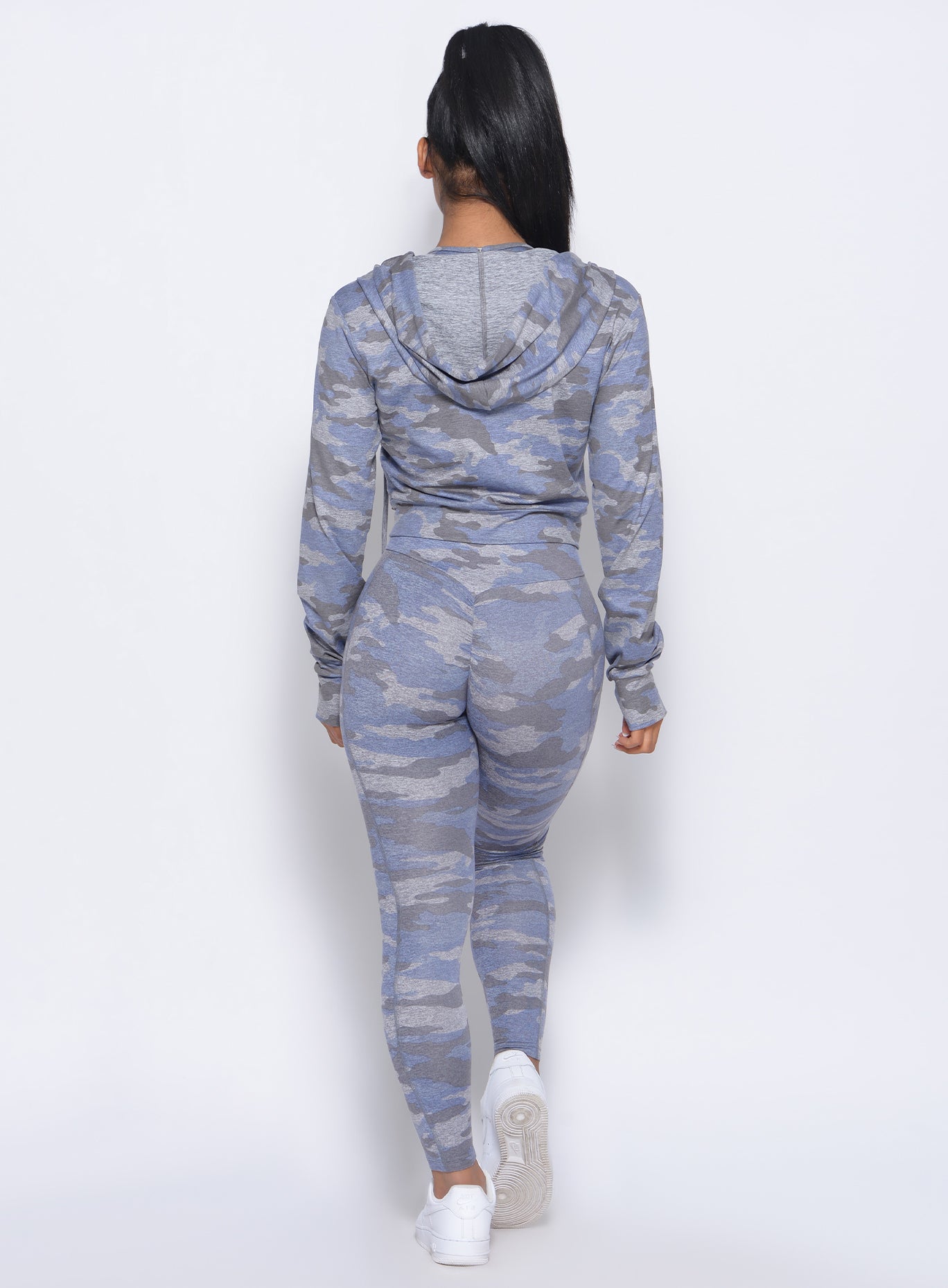 Back view of the model in our silver camo signature jacket and a matching leggings 